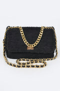Faux Fur Shoulder Bag with black textured faux fur body and gold and black chain strap, featuring a gold clasp closure.
