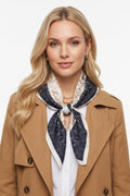 Botanical Drawing Flowers Print Bandana in navy and cream, worn around the neck with a beige trench coat for a stylish